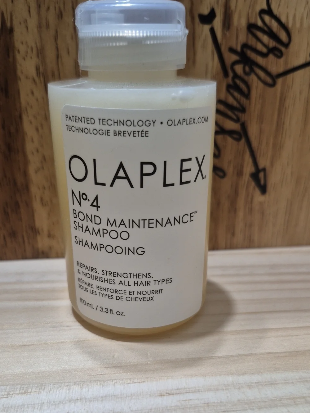 OLAPLEX No.4 Bond Maintenance Shampoo — Cream & White Bottle